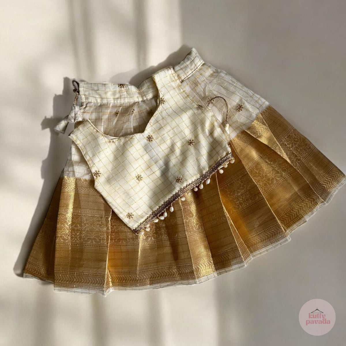 Checkered Gold Kasavu Pattupavada with Pearl Trim