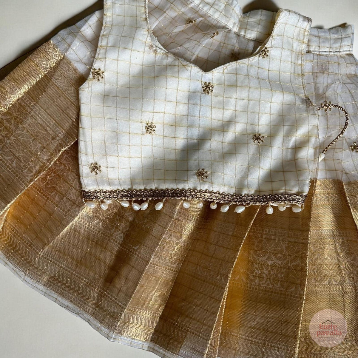 Checkered Gold Kasavu Pattupavada with Pearl Trim